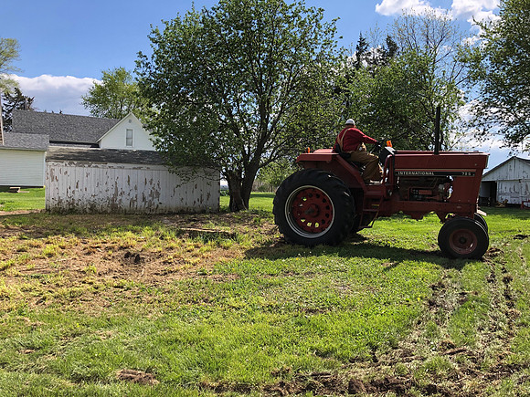 Pulling the hog troughs buried in dirt